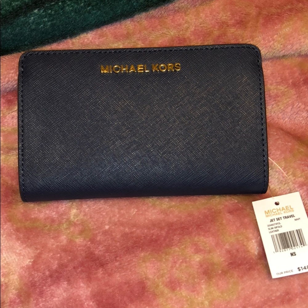 **SOLD**Mk jet set travel slim bifold leather wall